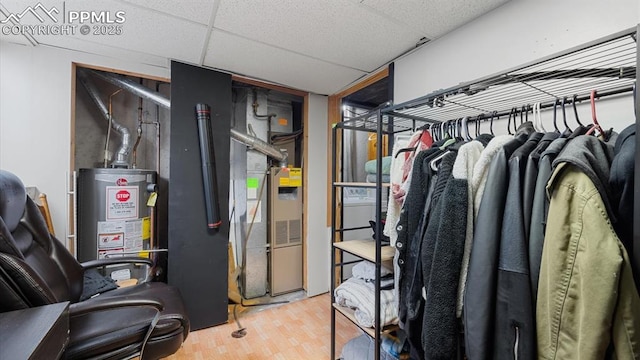 utility room with water heater