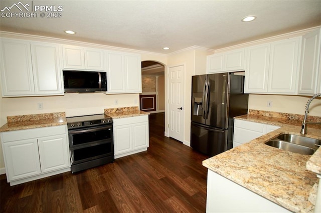 kitchen featuring stainless steel appliances, white cabinetry, sink, and dark hardwood / wood-style floors