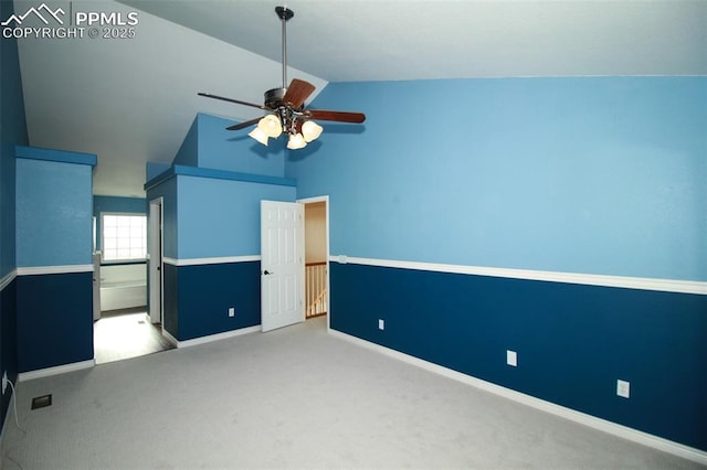 unfurnished bedroom with lofted ceiling, light colored carpet, and ceiling fan