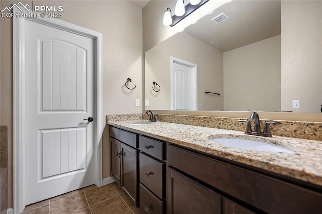 bathroom with vanity and tile patterned flooring