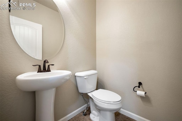 bathroom with tile patterned floors and toilet