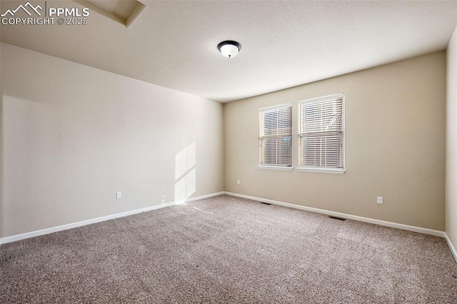 view of carpeted spare room