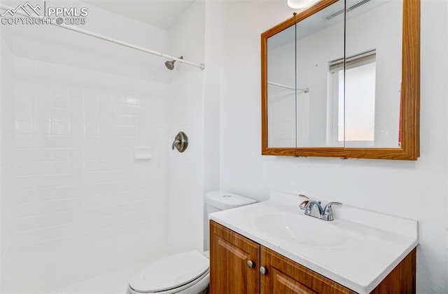 full bath featuring toilet, visible vents, walk in shower, and vanity