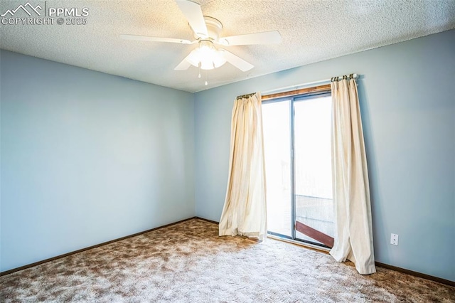 carpeted spare room featuring a textured ceiling and ceiling fan