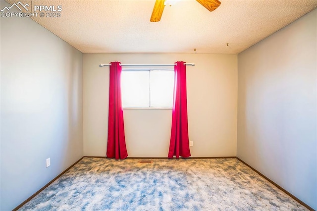 carpeted empty room with a textured ceiling and ceiling fan