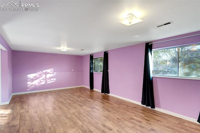 empty room featuring light hardwood / wood-style floors