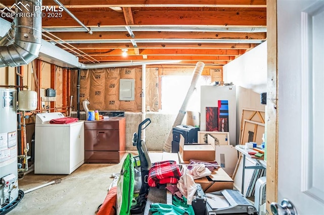 basement with water heater and washer / dryer