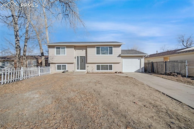 bi-level home featuring a garage