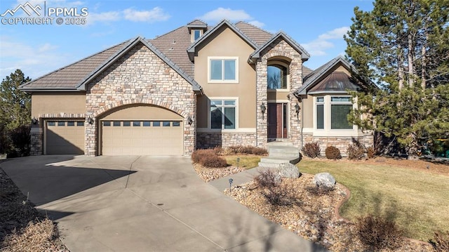 view of front of house with a garage and a front yard