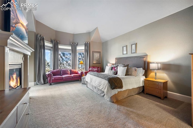 bedroom with vaulted ceiling and carpet flooring