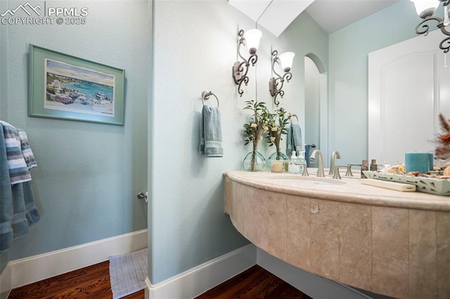 bathroom with wood-type flooring and sink