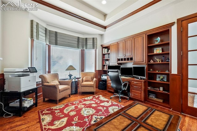 home office with crown molding and dark hardwood / wood-style flooring