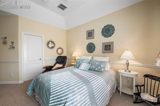 bedroom with vaulted ceiling and carpet