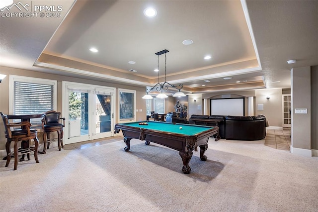 rec room featuring french doors, light carpet, pool table, and a tray ceiling