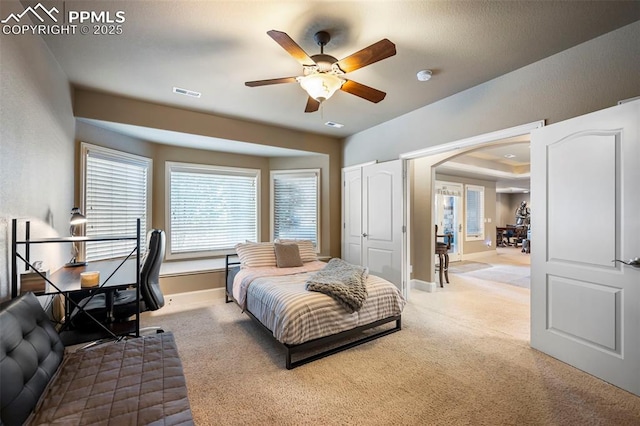 carpeted bedroom with ceiling fan