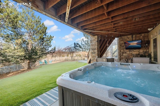 view of swimming pool with a hot tub and a yard