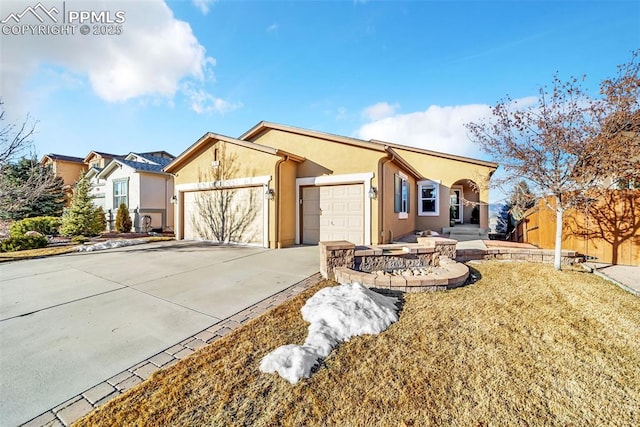 ranch-style home with a front yard and a garage