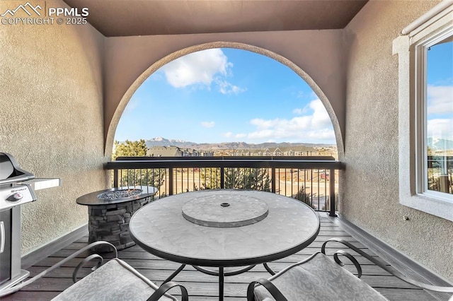 balcony featuring a mountain view and area for grilling