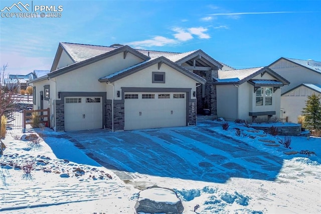 view of front of house featuring stucco siding, concrete driveway, an attached garage, fence, and stone siding