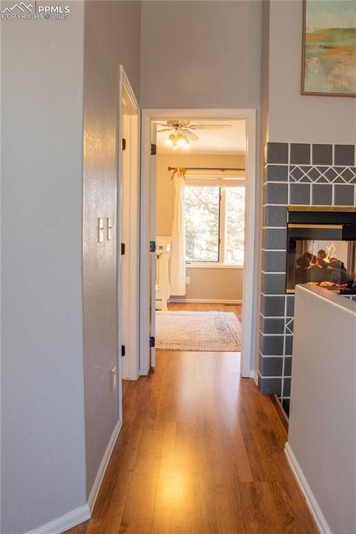 hall with hardwood / wood-style floors