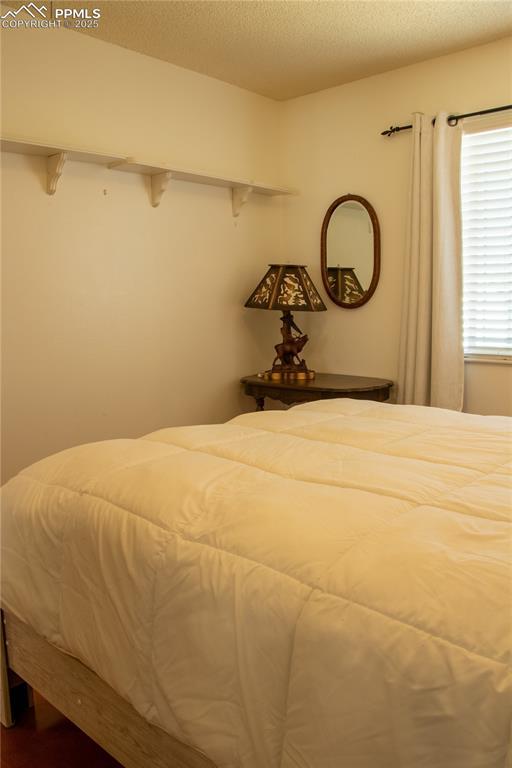 unfurnished bedroom featuring a textured ceiling