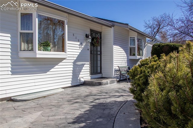 property entrance with a patio