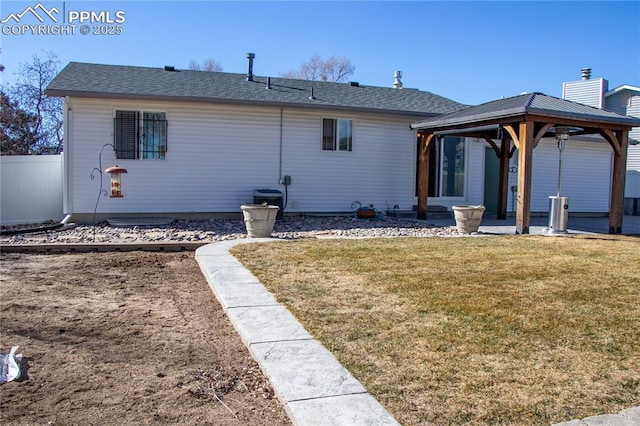 view of front of house featuring a gazebo and a front yard