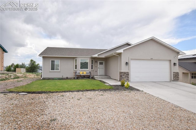 single story home with a garage and a front yard