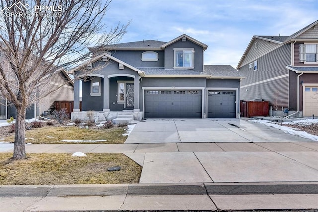 traditional home with stucco siding and driveway