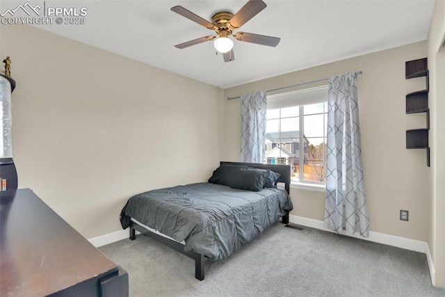 bedroom with baseboards, carpet, and a ceiling fan