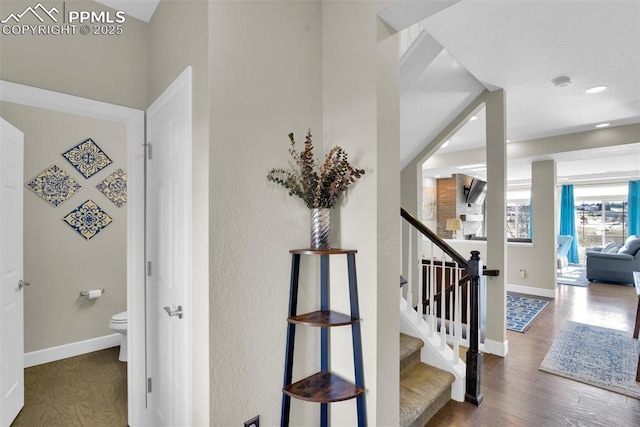 interior space featuring recessed lighting, wood finished floors, and baseboards