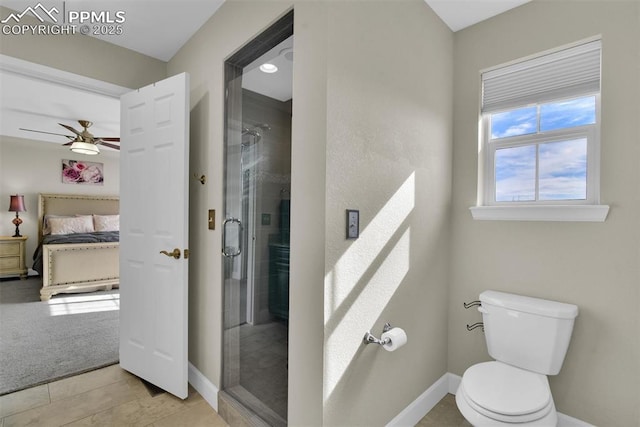 bathroom featuring a shower stall, baseboards, toilet, ensuite bathroom, and a ceiling fan