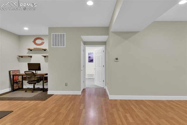 office featuring recessed lighting, visible vents, baseboards, and light wood-style floors