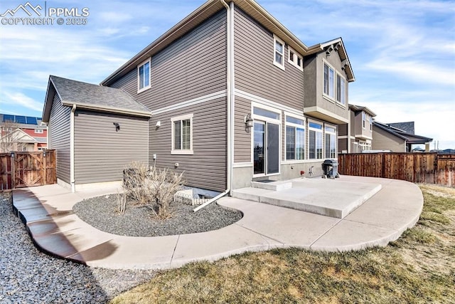 back of house featuring fence and a patio area