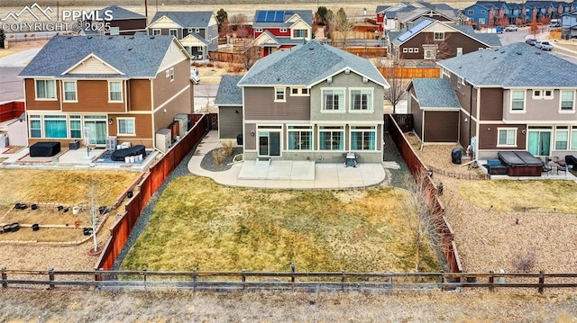 back of house with a patio, a fenced backyard, and a residential view