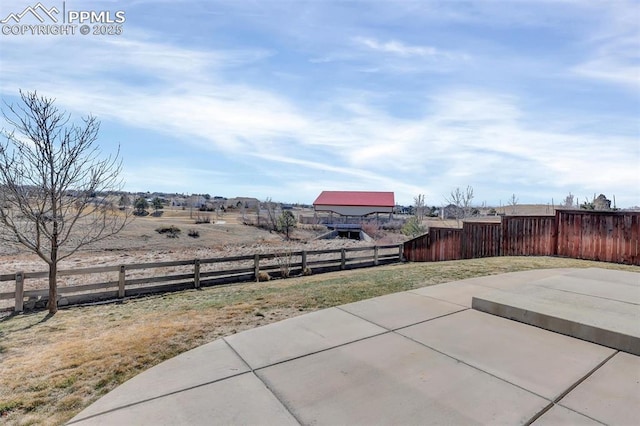 view of yard with a fenced backyard and a patio