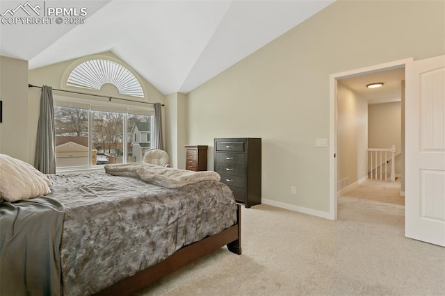 carpeted bedroom with baseboards, lofted ceiling, and visible vents