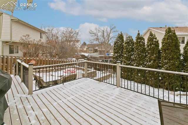 view of snow covered deck