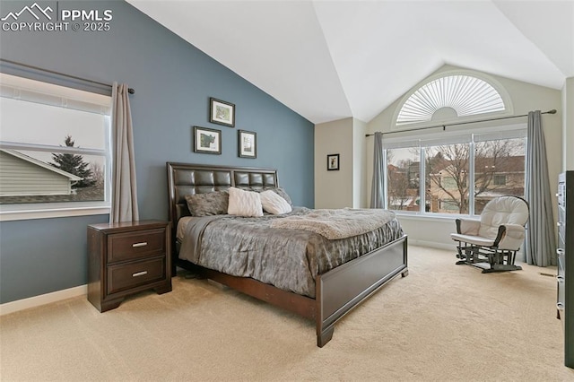 bedroom featuring light carpet, baseboards, and vaulted ceiling