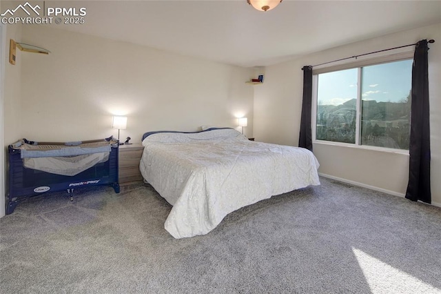 carpeted bedroom featuring baseboards and visible vents