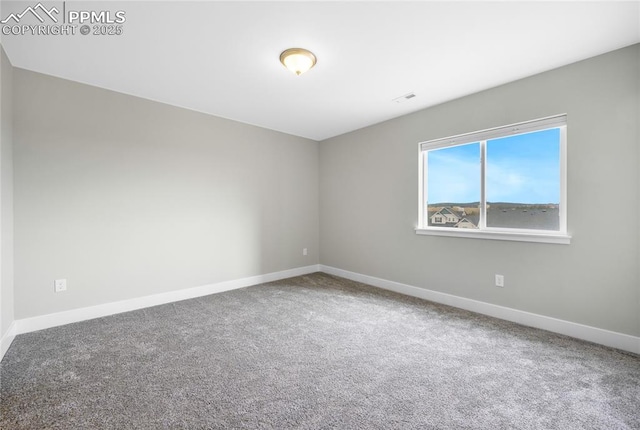 empty room featuring carpet flooring