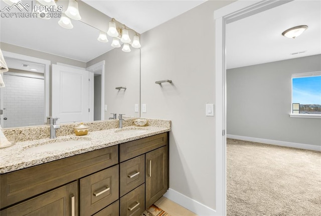 bathroom featuring vanity and a shower