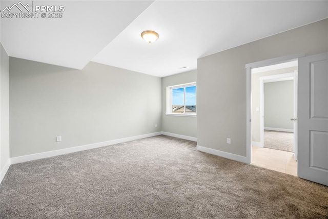 empty room featuring light carpet