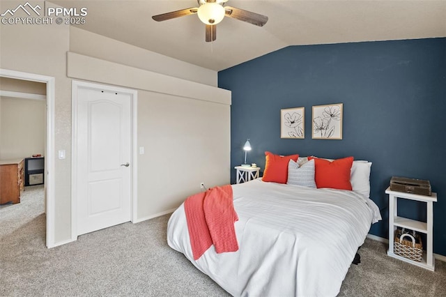 carpeted bedroom featuring vaulted ceiling, a closet, and ceiling fan