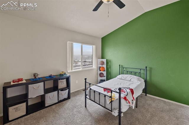 bedroom featuring ceiling fan, vaulted ceiling, and carpet