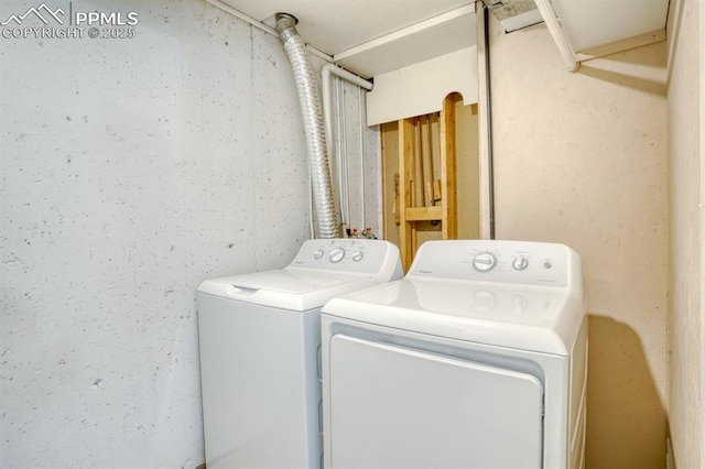 washroom with washing machine and clothes dryer