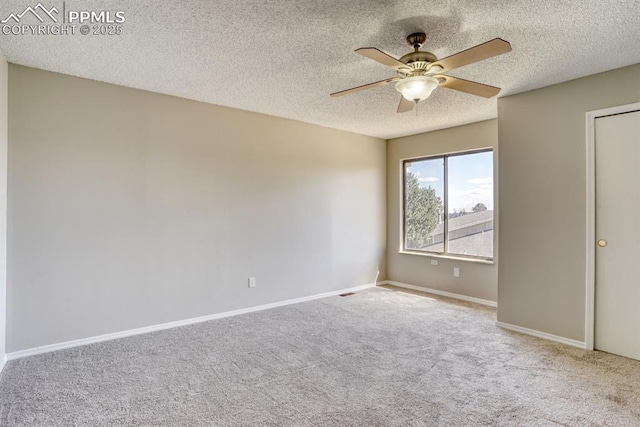 interior space with a textured ceiling and ceiling fan