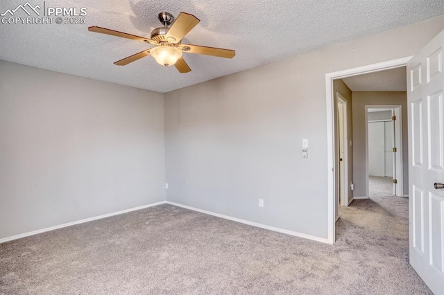 carpeted spare room with ceiling fan and a textured ceiling