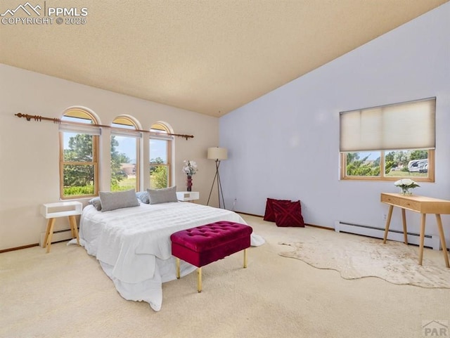 carpeted bedroom with lofted ceiling, a baseboard radiator, and a textured ceiling