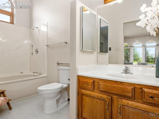 bathroom with toilet, tub / shower combination, vanity, a textured ceiling, and tile patterned flooring